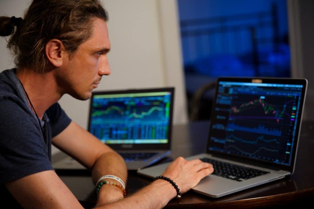 Man day trading in front of his computer