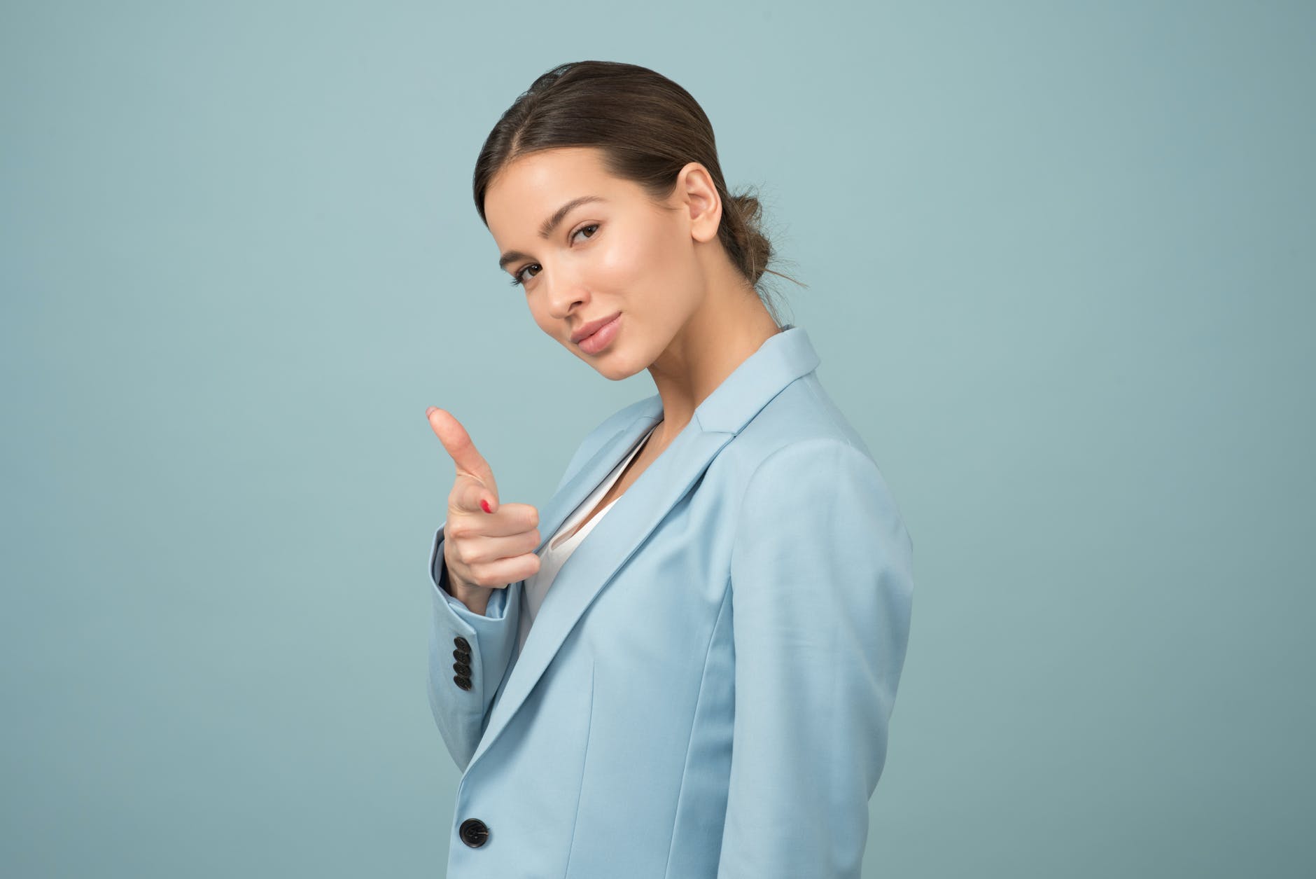 woman wearing blue shawl lapel suit jacket