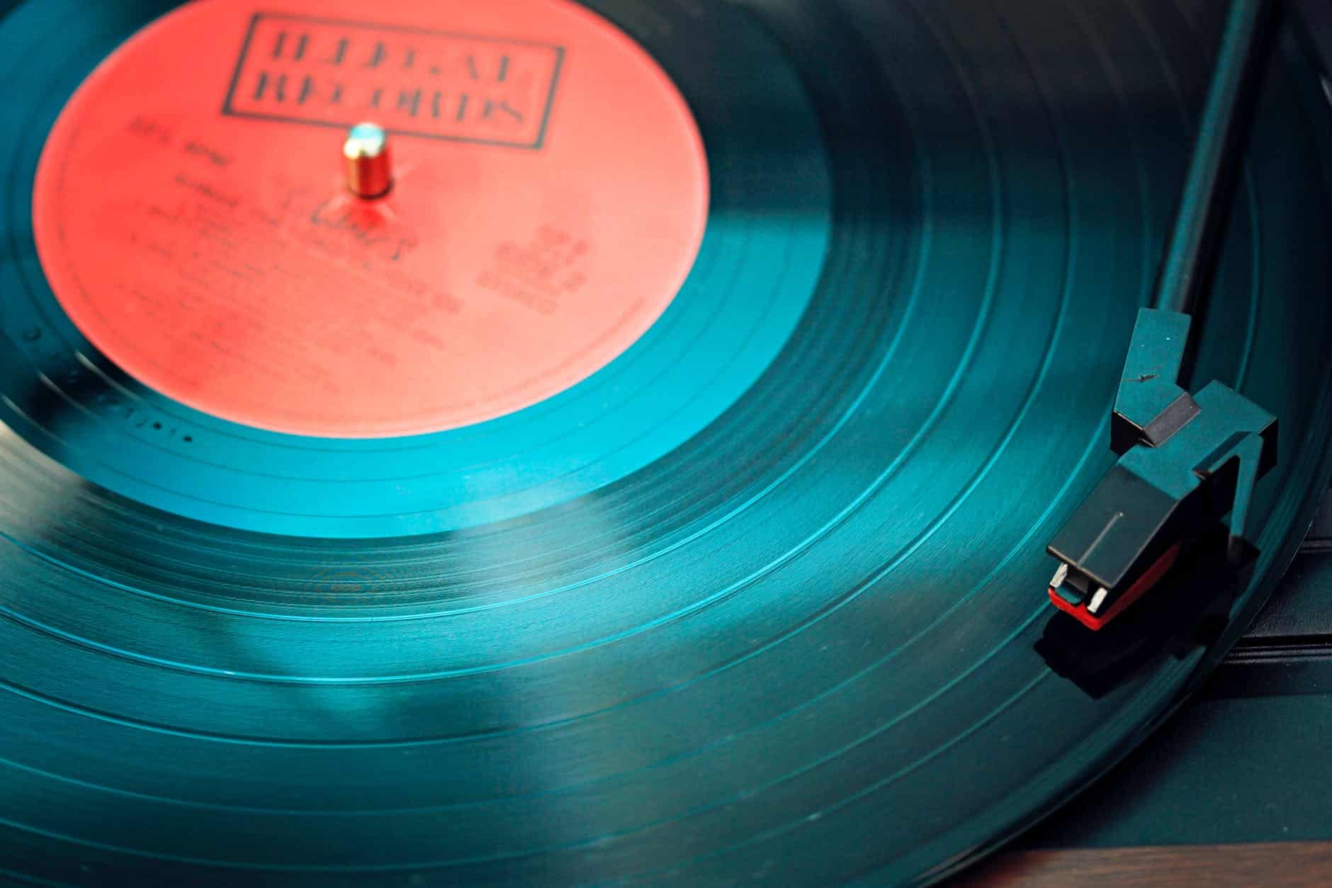 blue vinyl record playing on turntable