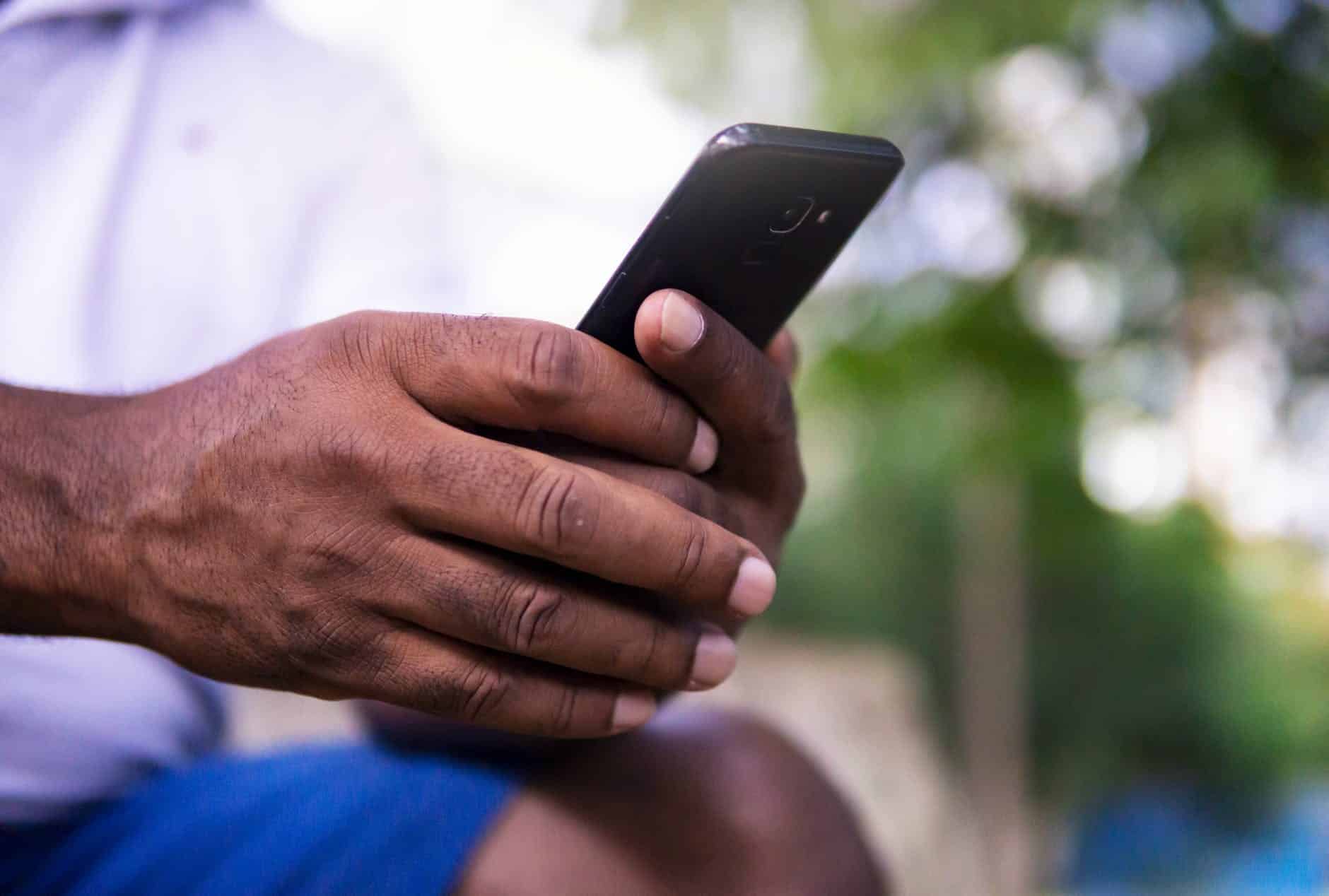 person holding black android smartphone