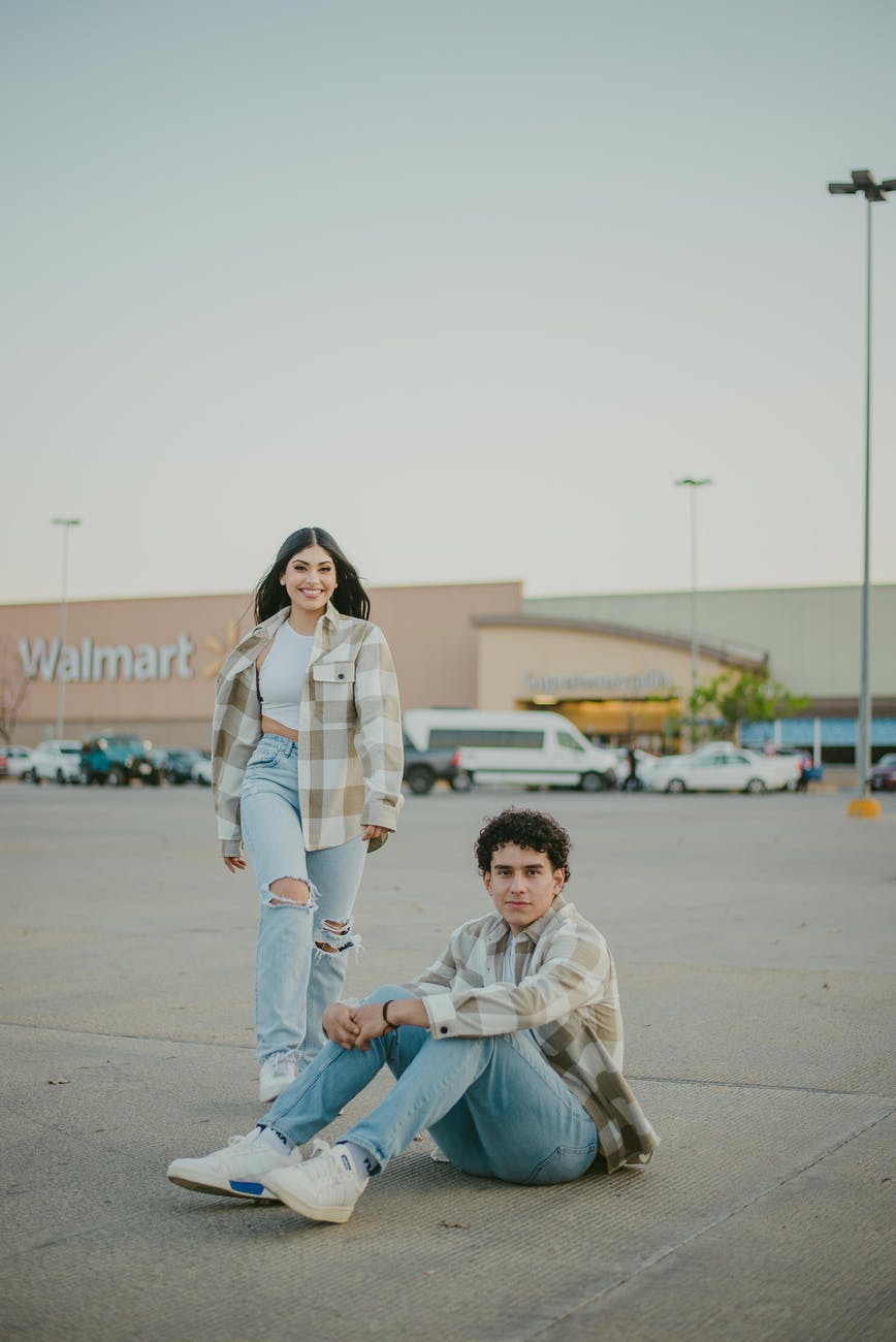 man and woman smiling at walmart car park