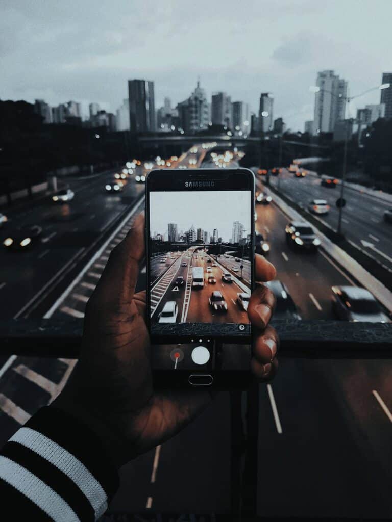 Samsung Deals 1 person taking photo of cars on road