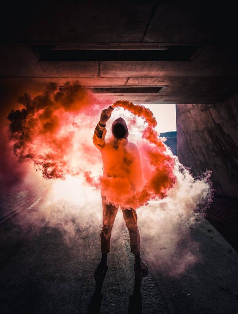 photo of person with colored smoke