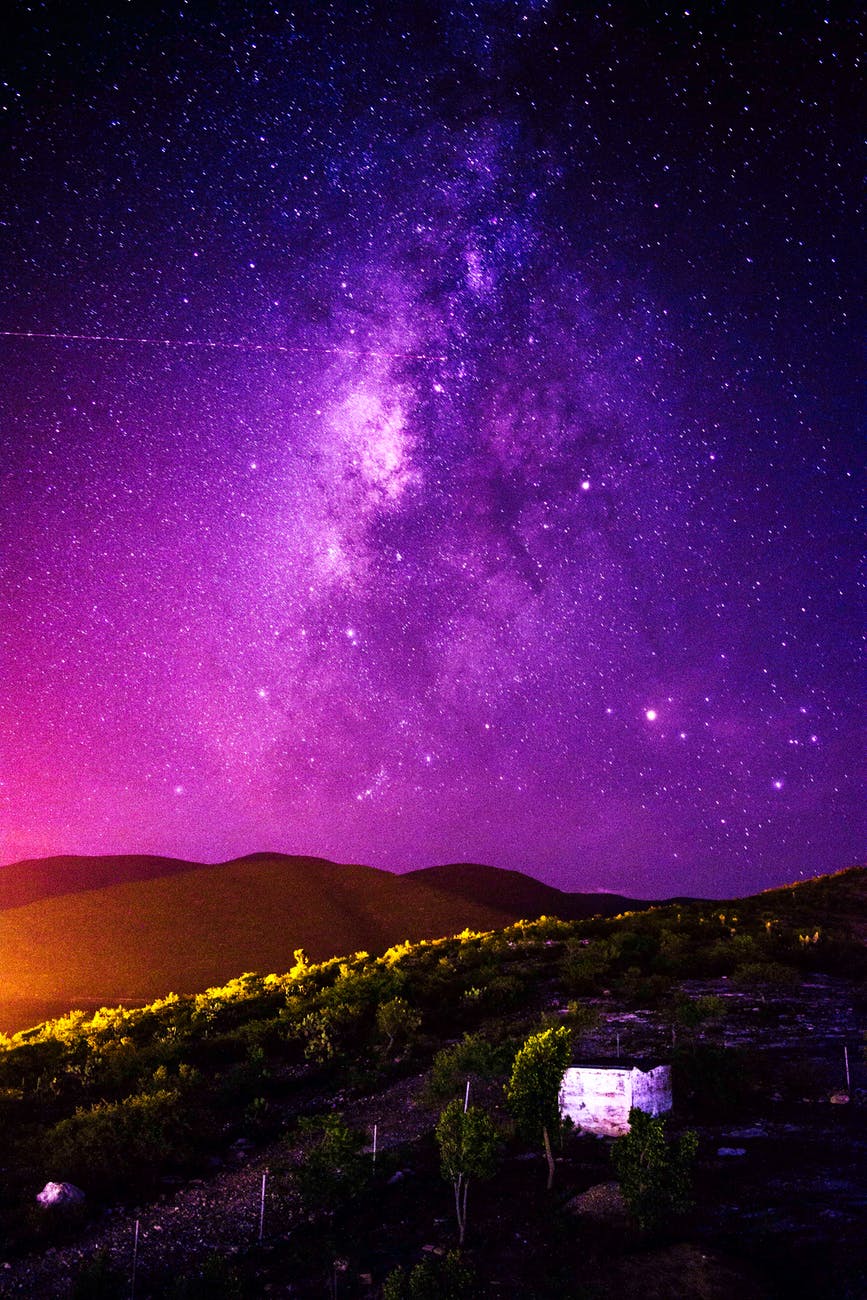 view of countryside under evening purple sky