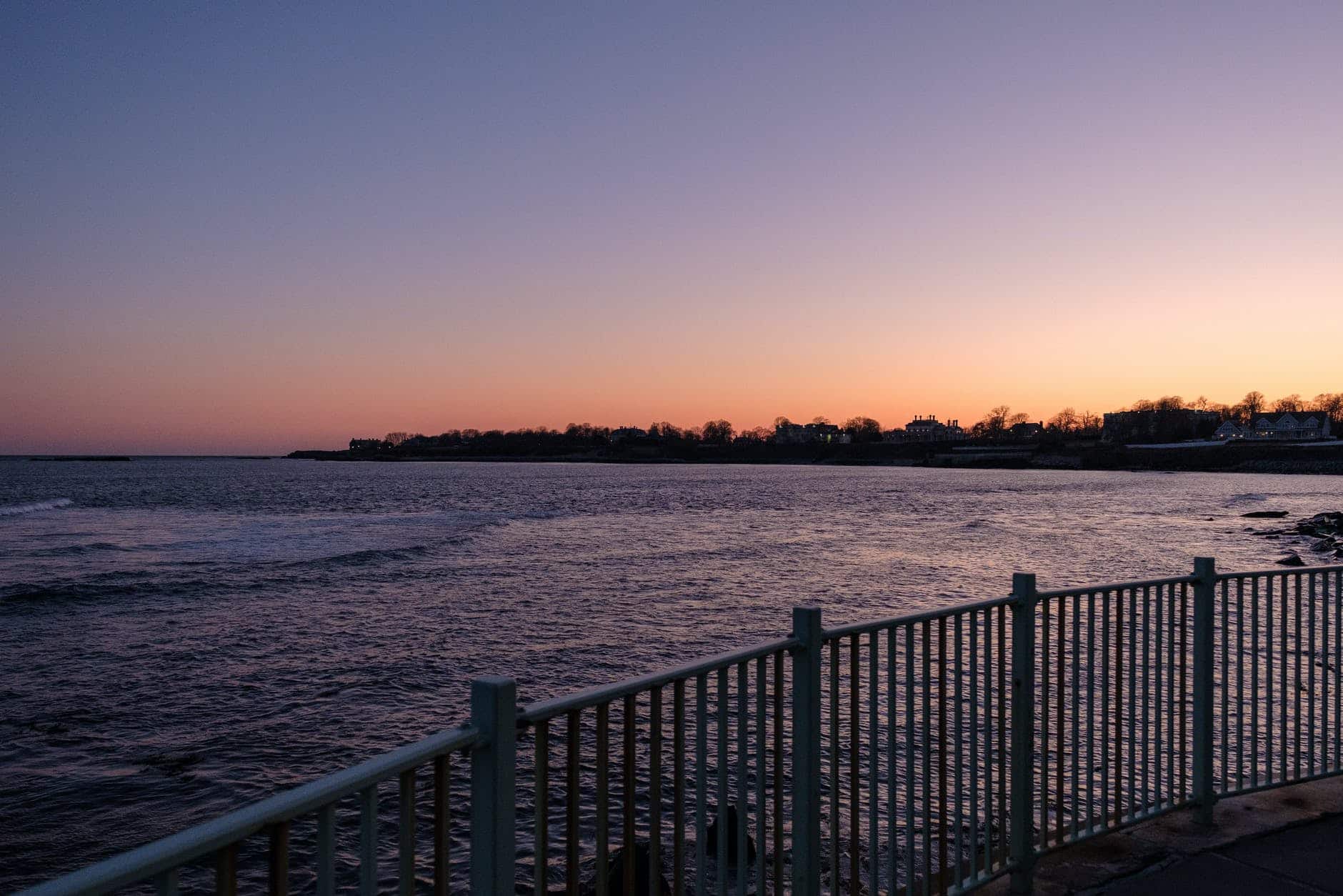 viewing platform with metal railings under sunset sky