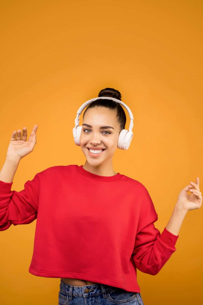 white headphones wear by a young lady