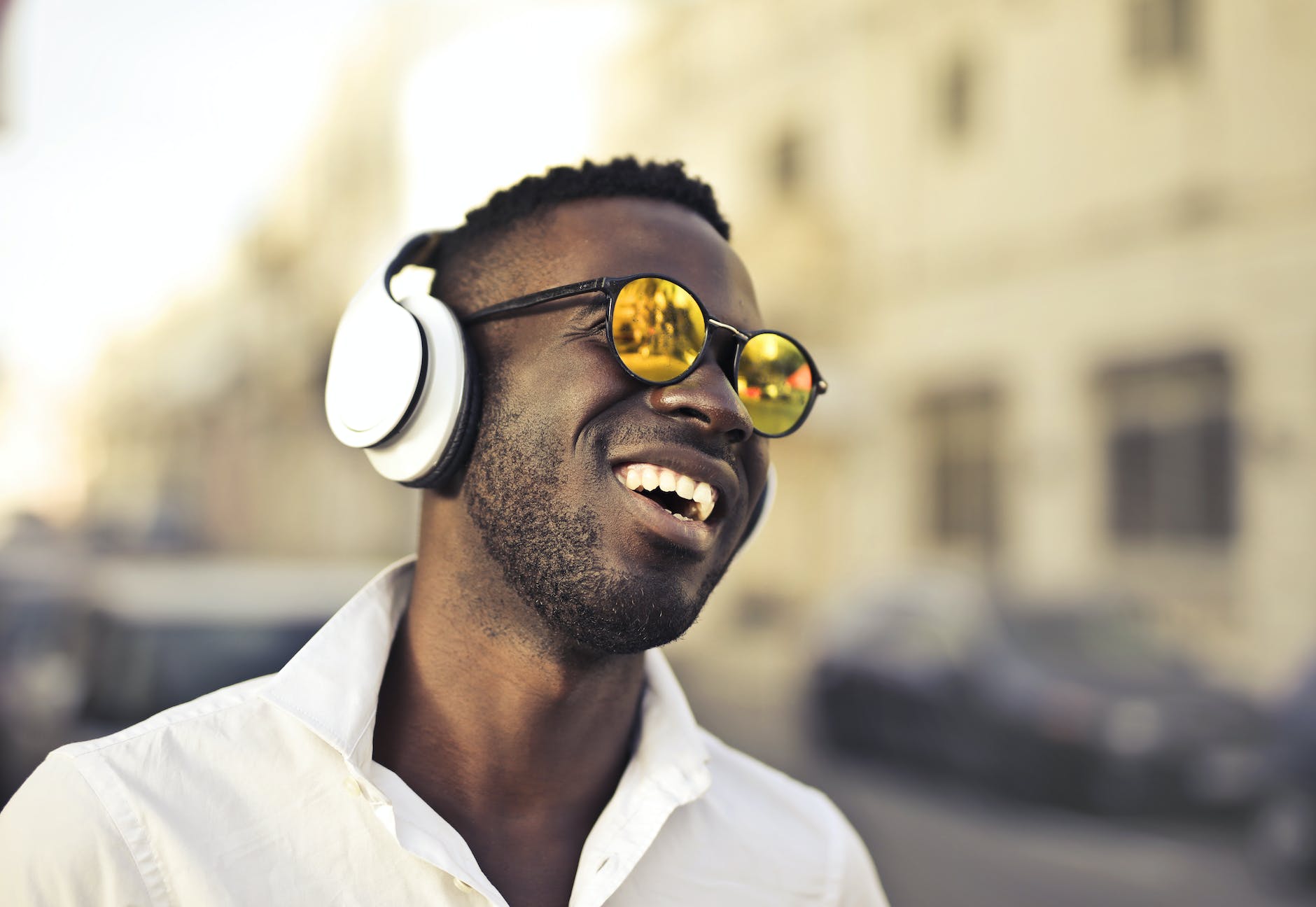 photo of man using headphones