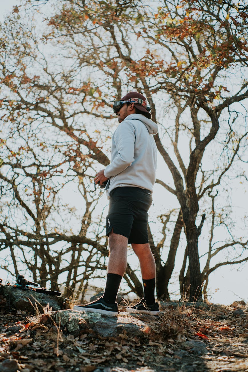 Powerful charging speed of HyperX headsets and tips for optimal use for beginners in the tech world. 1 man engaging with fpv drone in scenic outdoors